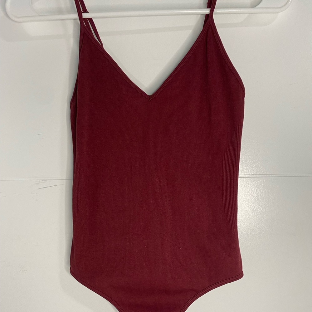 Marrón V cut bodysuit.